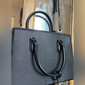 Elegant Black Handbag with Gold Accents